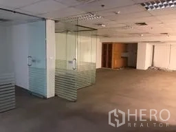 Office Space for rent in Bang Rak, Bangkok - Glass-partitioned meeting rooms with frosted panels inside an unfurnished office space.