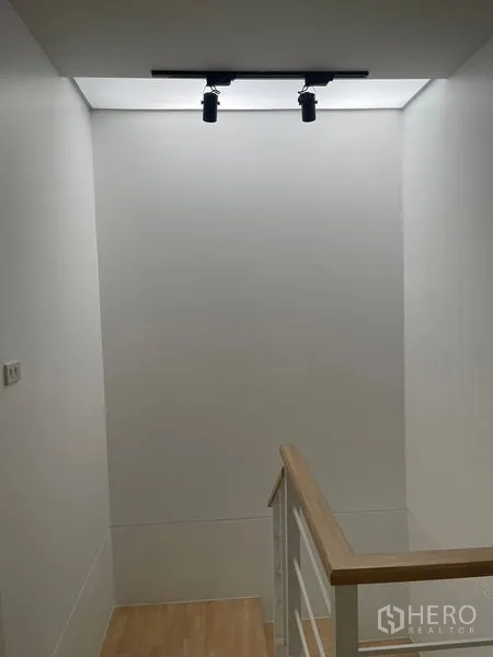 Townhouse for sale - Stairwell with skylight and modern track lighting