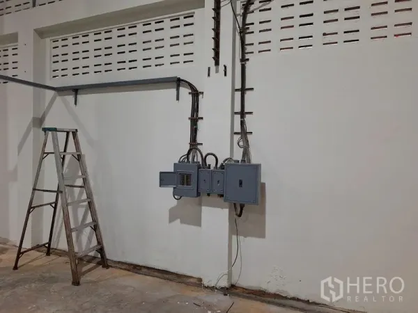 Warehouse for rent in Rat Burana, Bangkok - Electrical control panels mounted on the interior wall of the warehouse.