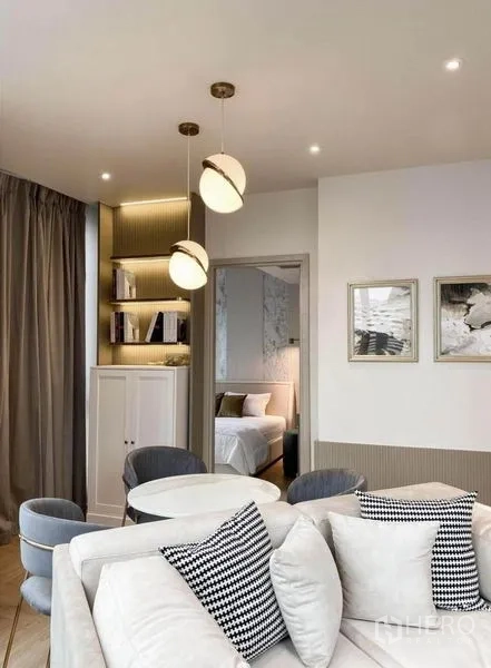 Condominium for rent in Din Daeng, Bangkok - Dining corner with round table, velvet chairs, shelving and globe pendant lights.