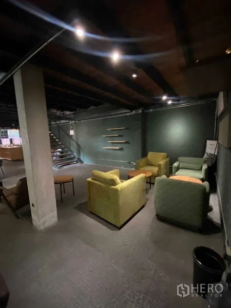 Retail Space for rent in Bang Na, Bangkok - Cozy corner lounge with armchairs against a dark accent wall
