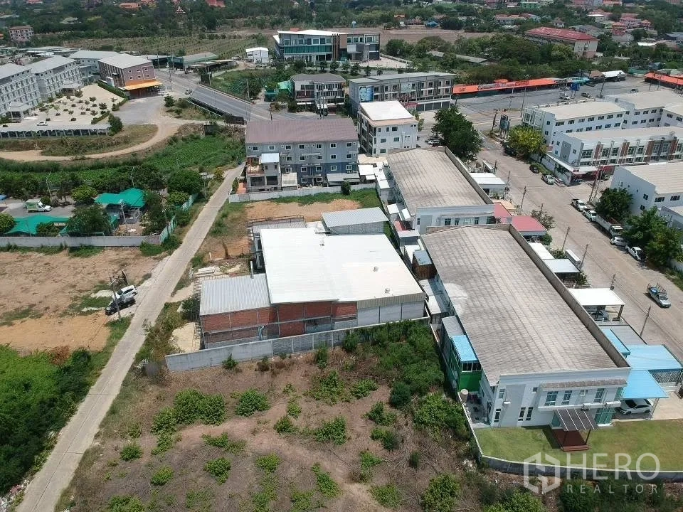 Land for sale in Phra Nakhon Si Ayutthaya, Phra Nakhon Si Ayutthaya - Aerial context showing the access lane connecting the plot to a main road and nearby commercial blocks.