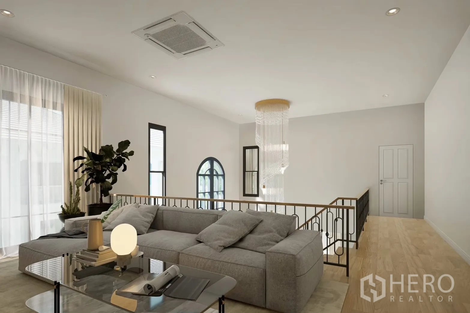 独立式住宅 出租在Bang Phli, Samut Prakan - 二层休闲区，转角沙发与瀑布吊灯。