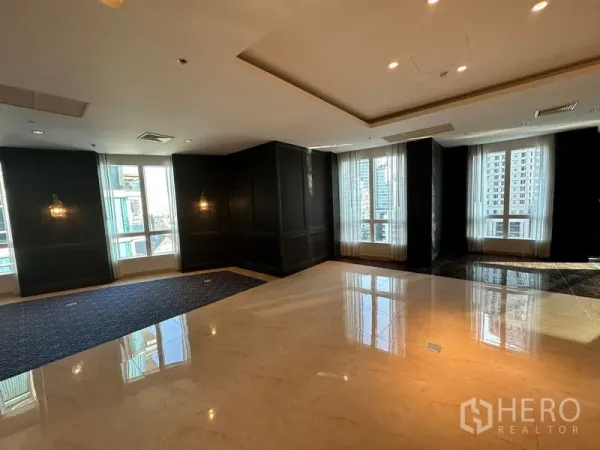 Office Space for rent - Open office space with glossy tile floors, dark wall panels and floor‑to‑ceiling windows with city views.