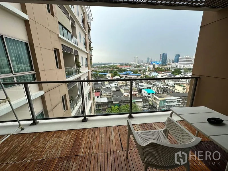 Condominium for rent in Yan Nawa, Bangkok - Deep balcony with timber decking and Yan Nawa skyline outlook.