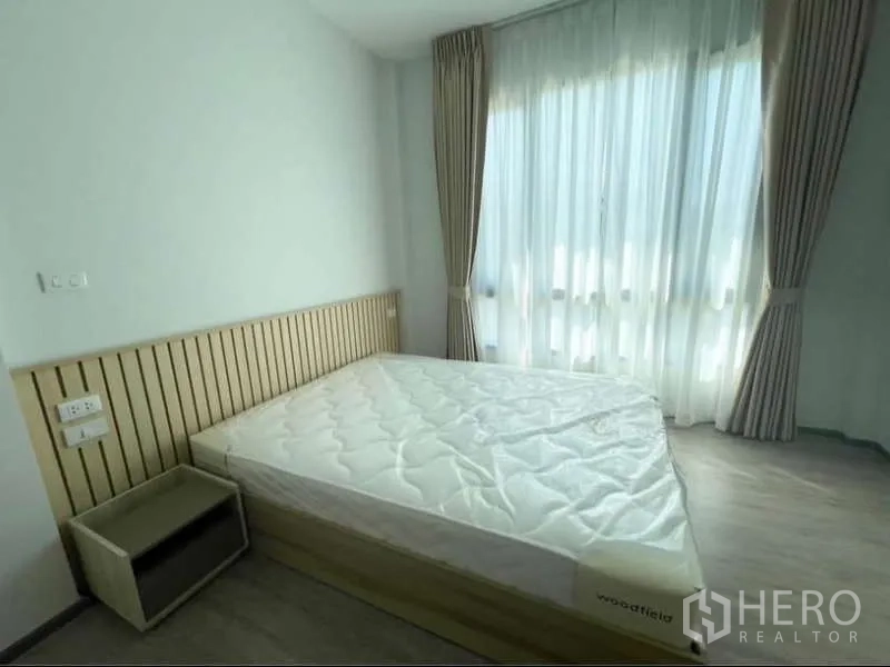 Detached House for rent in Bang Phli, Samut Prakan - Bright bedroom with large window, sheer curtains and a bed in soft neutral tones.