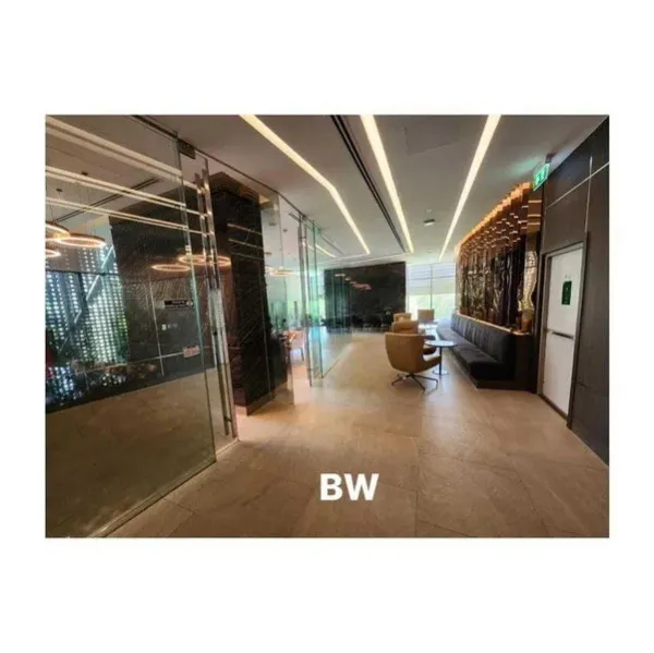 Condominium for rent in Phra Khanong, Bangkok - Elegant condominium lobby lounge with glass walls, accent lighting and seating