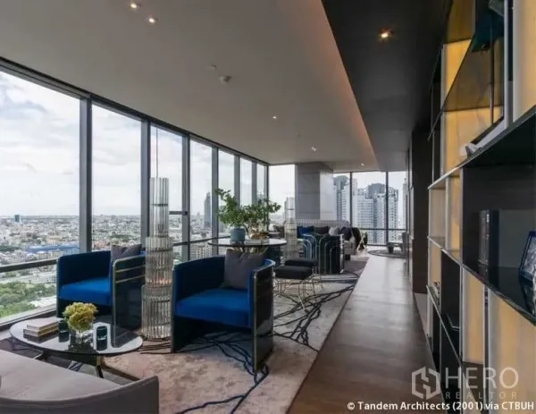 Condominium for rent in Sathon, Bangkok - Sky lounge with floor-to-ceiling glass and modern seating overlooking the city.