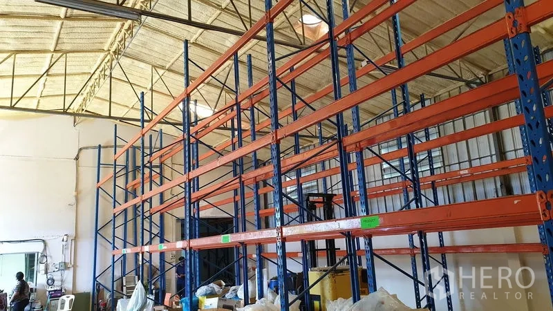 Warehouse for rent in Suan Luang, Bangkok - Wide warehouse interior showing multiple pallet racks and an insulated high ceiling.