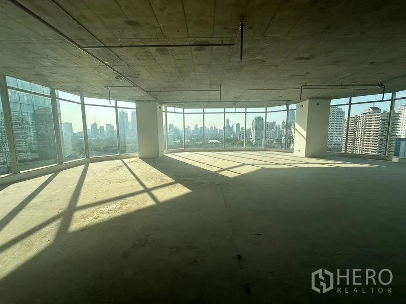 Office Space for rent in Watthana, Bangkok - Corner office space with floor-to-ceiling windows and panoramic Bangkok skyline views.