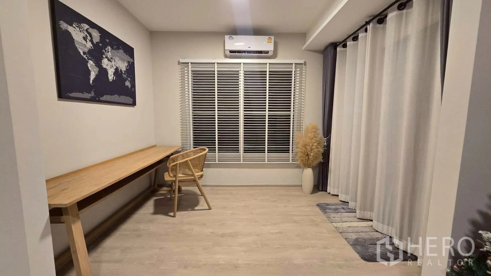 Semi-detached House for rent in Prawet, Bangkok - Dedicated study room with long work desk, chair, blinds and air conditioner.