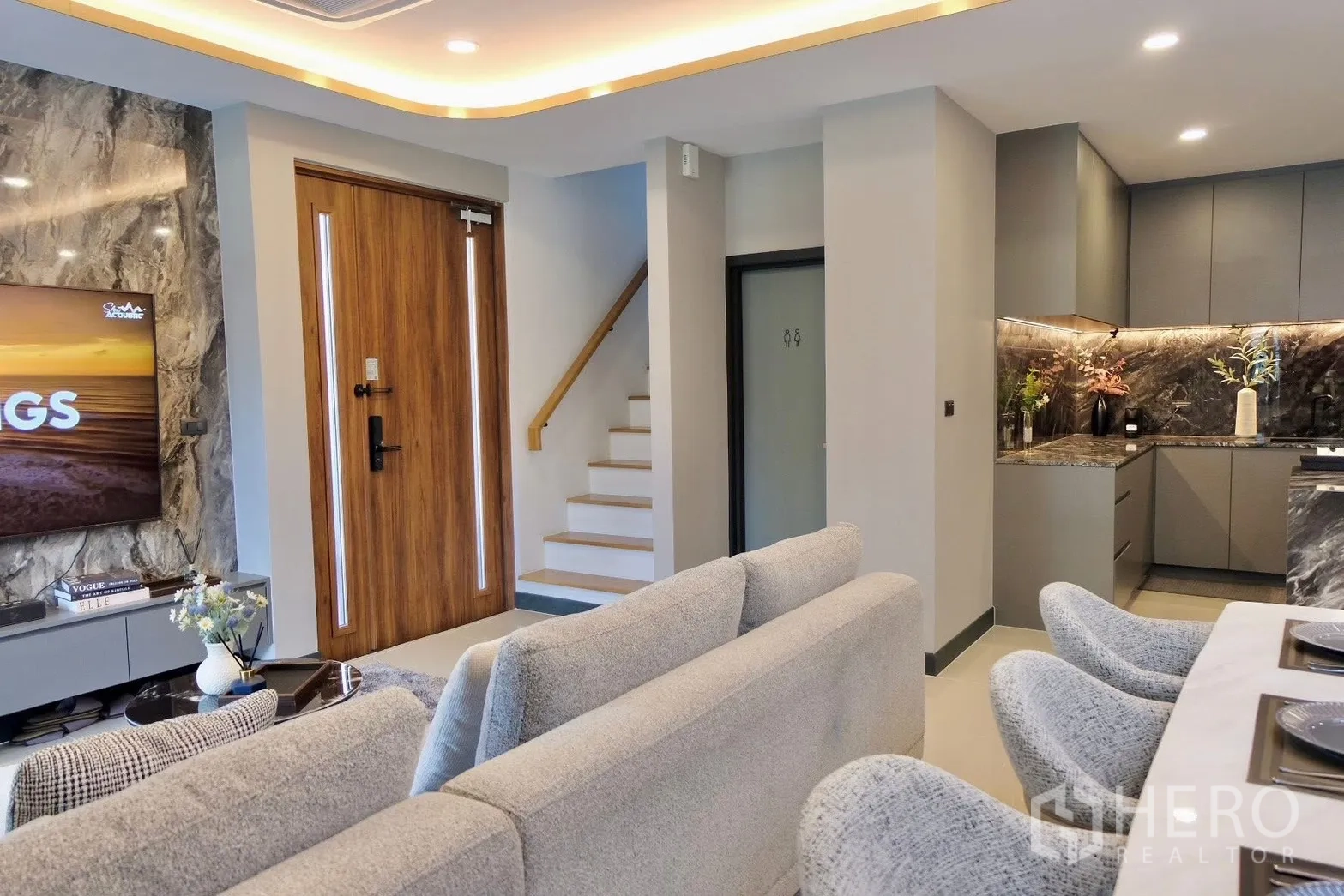 Semi-detached House for sale in Prawet, Bangkok - Feature TV wall with marble finish opposite the entrance door.