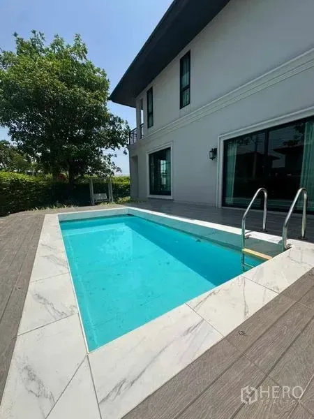 Detached House for sale in Prawet, Bangkok - Private plunge pool beside the house with marble coping and wood deck.