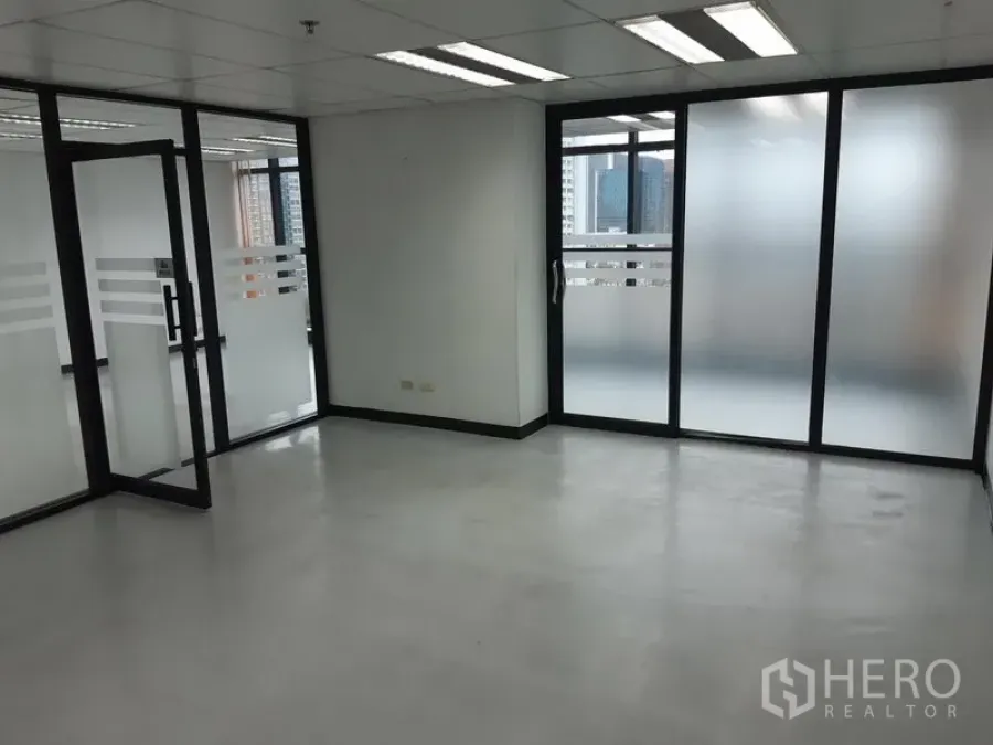 Office Space for rent in Watthana, Bangkok - Private office room with sliding frosted glass doors and natural light.