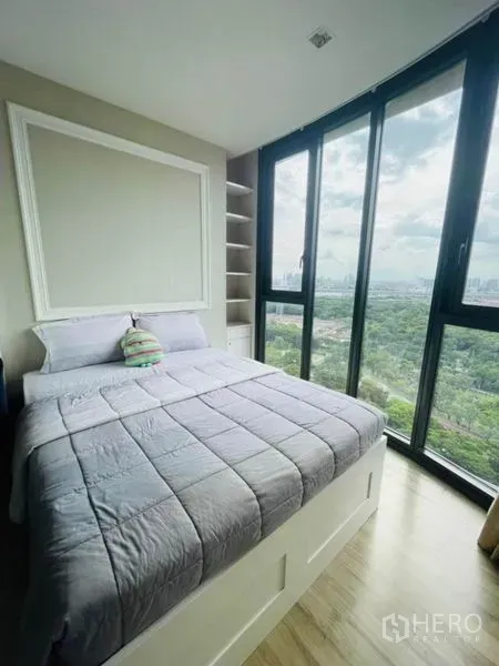 Condominium for rent - Light-filled bedroom with bay windows, built-in shelves and treetop views.
