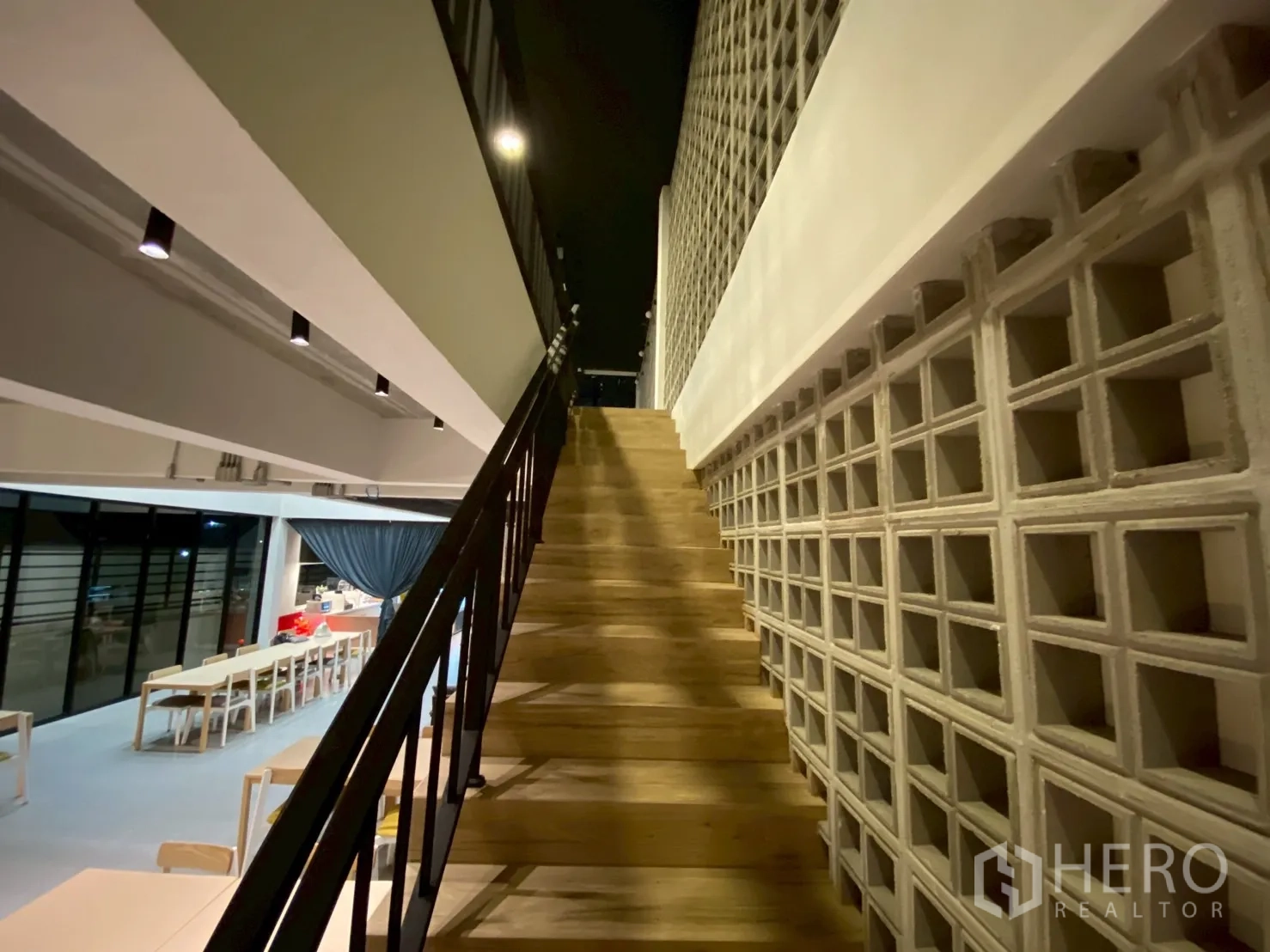Detached House for sale in Mueang Nakhon Pathom, Nakhon Pathom - Side view of stairway beside a breeze-block feature wall and track lighting.