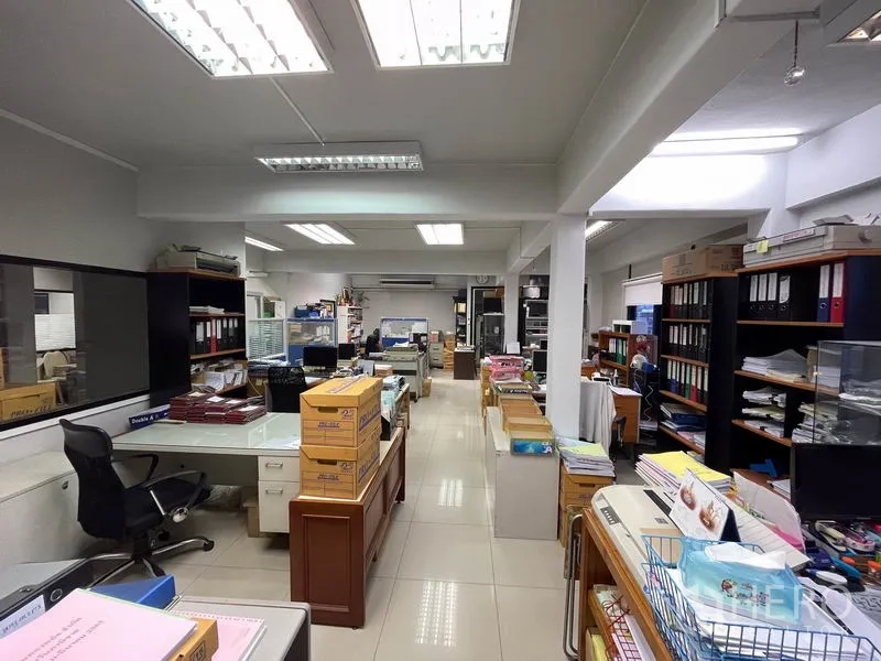 Office Space for rent in Khlong Toei, Bangkok - Spacious open-plan office with desks, shelving, tiled floors and bright fluorescent lighting.