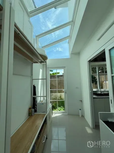 Detached House for rent or sale - Bright utility corridor with glass skylight ceiling and door to the garden.