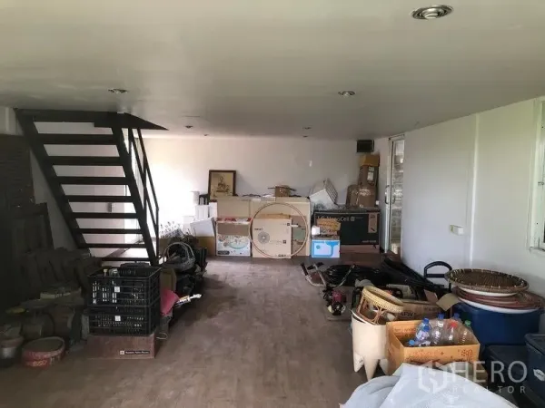 Warehouse for rent in Bang Bua Thong, Nonthaburi - Mezzanine office and storage room with staircase inside the warehouse.