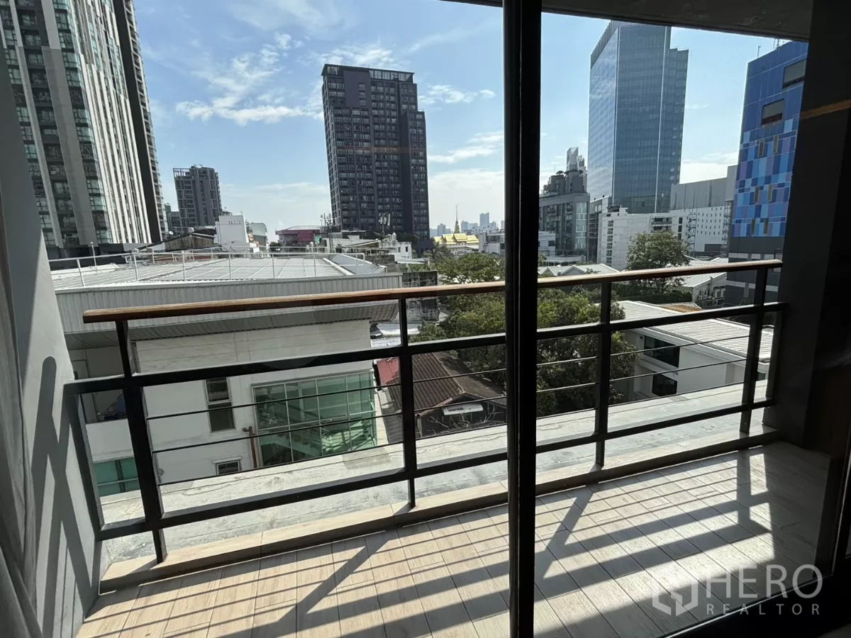 Condominium for sale in Watthana, Bangkok - Private balcony with railing and urban skyline views in Sukhumvit.