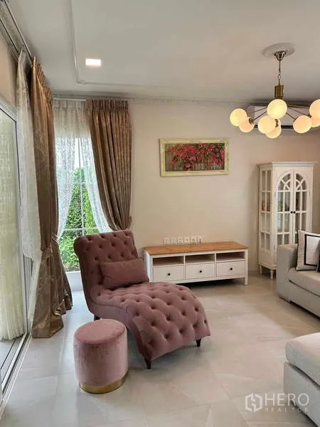 Detached House for sale in Bang Phli, Samut Prakan - Cozy living area with tufted pink chaise, large windows and curtains