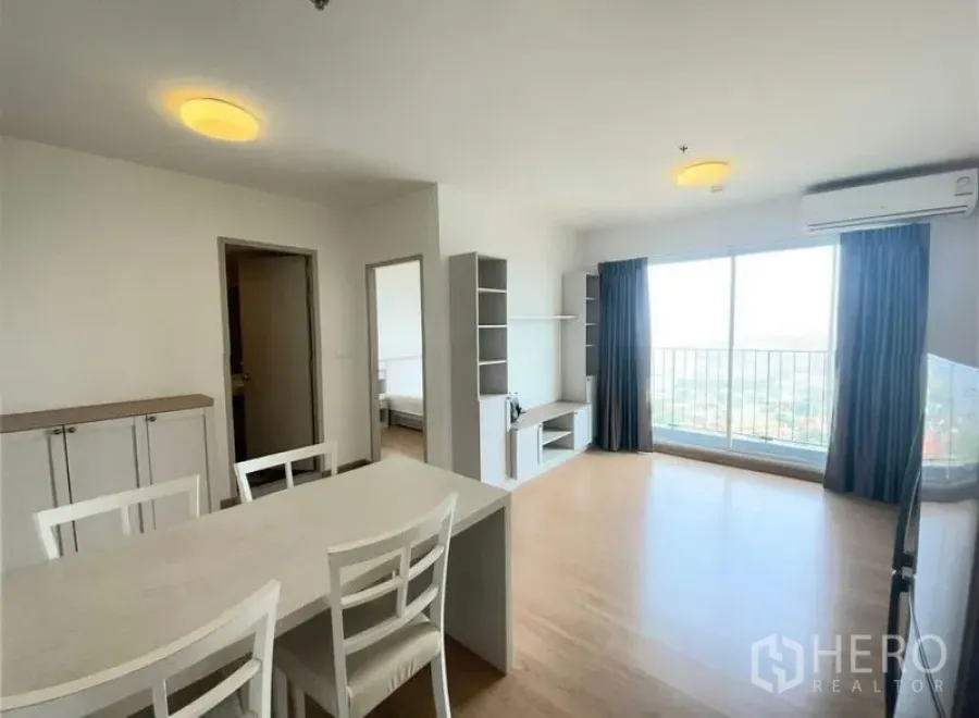 Condominium for sale - Living and dining space with sliding balcony doors and abundant natural light.