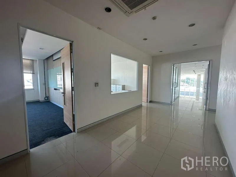 Office Space for rent in Prawet, Bangkok - Entrance lobby with glass double doors, internal viewing window and polished tile floor.