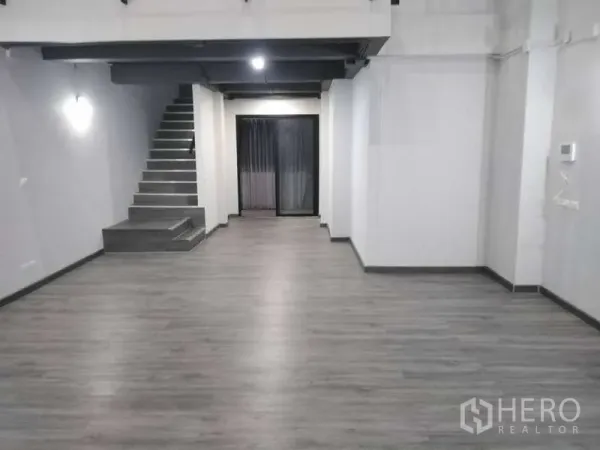 Home Office for rent or sale - Spacious ground-floor open plan area with staircase, grey vinyl floors and rear sliding door.