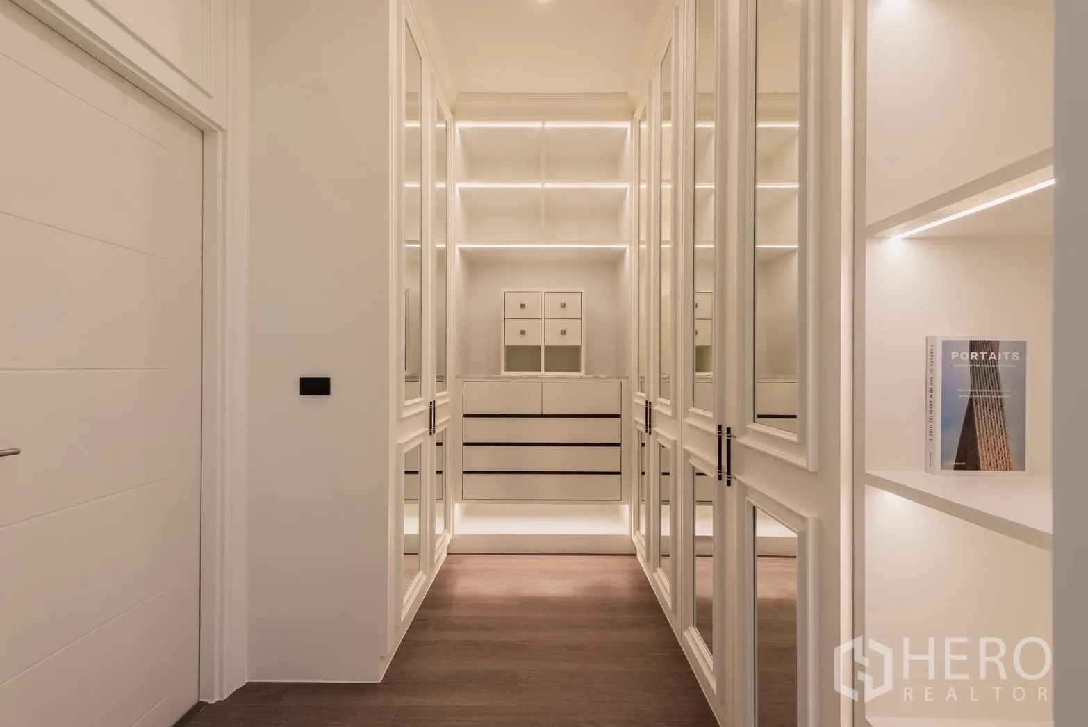 Detached House for rent or sale in Bang Phli, Samut Prakan - Walk-in closet corridor with mirrored doors and ambient LED lighting.