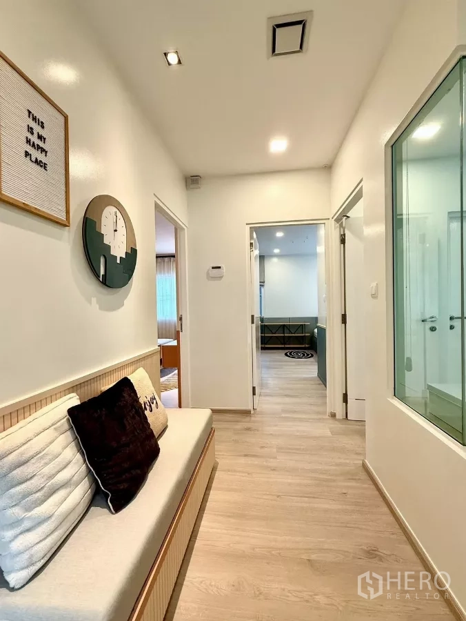 Detached House for rent in Bang Phli, Samut Prakan - Upstairs hallway with bench seating and soft wood flooring.