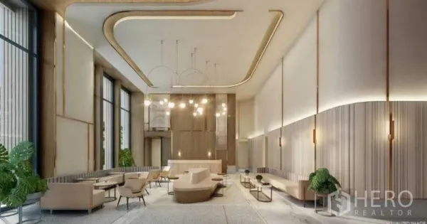 Condominium for sale in Sathon, Bangkok - Elegant high-ceiling condominium lobby with designer lighting and lounge seating.