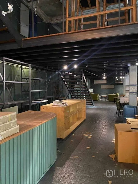 Retail Space for rent in Bang Na, Bangkok - Back-of-house shelving, timber counter and metal stairs