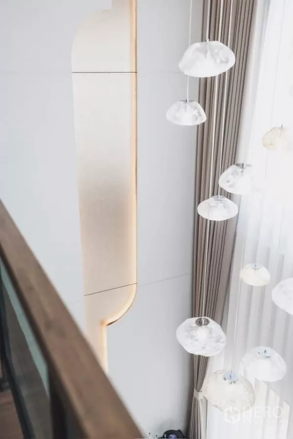 Detached House for rent in Bang Phli, Samut Prakan - Cluster pendant lights beside double-height curtains viewed from the upper floor.