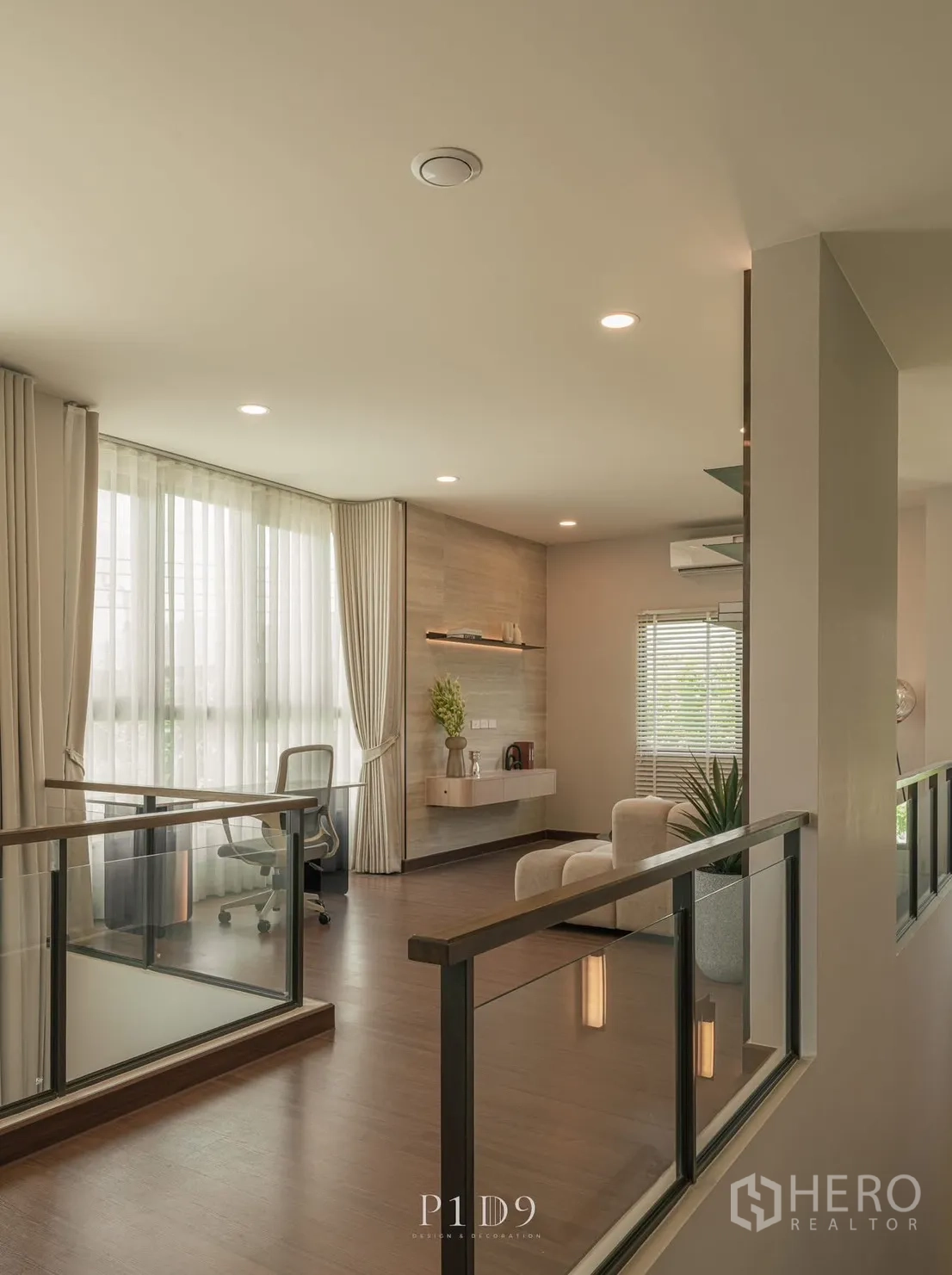 Detached House for rent in Bang Phli, Samut Prakan - Bright upstairs landing with glass balustrade and a desk by large curtained windows.