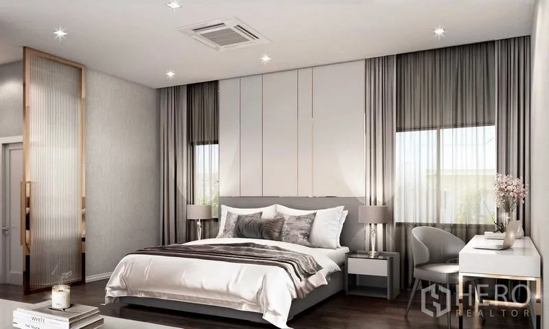 Detached House for sale in Prawet, Bangkok - Master bedroom with king bed, large windows, bedside lamps and study corner.