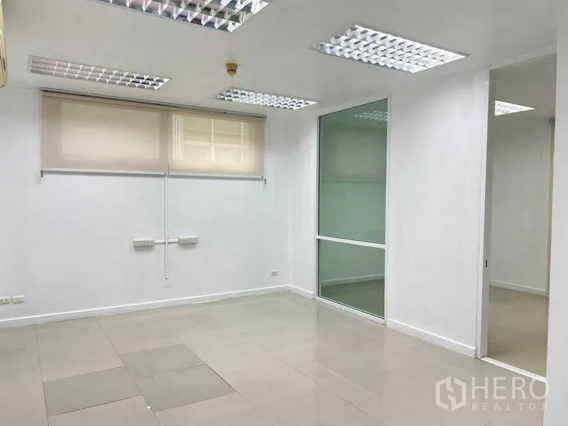 Office Space for rent in Wang Thonglang, Bangkok - Private office room with window blinds, a glass divider, and recessed ceiling lights.