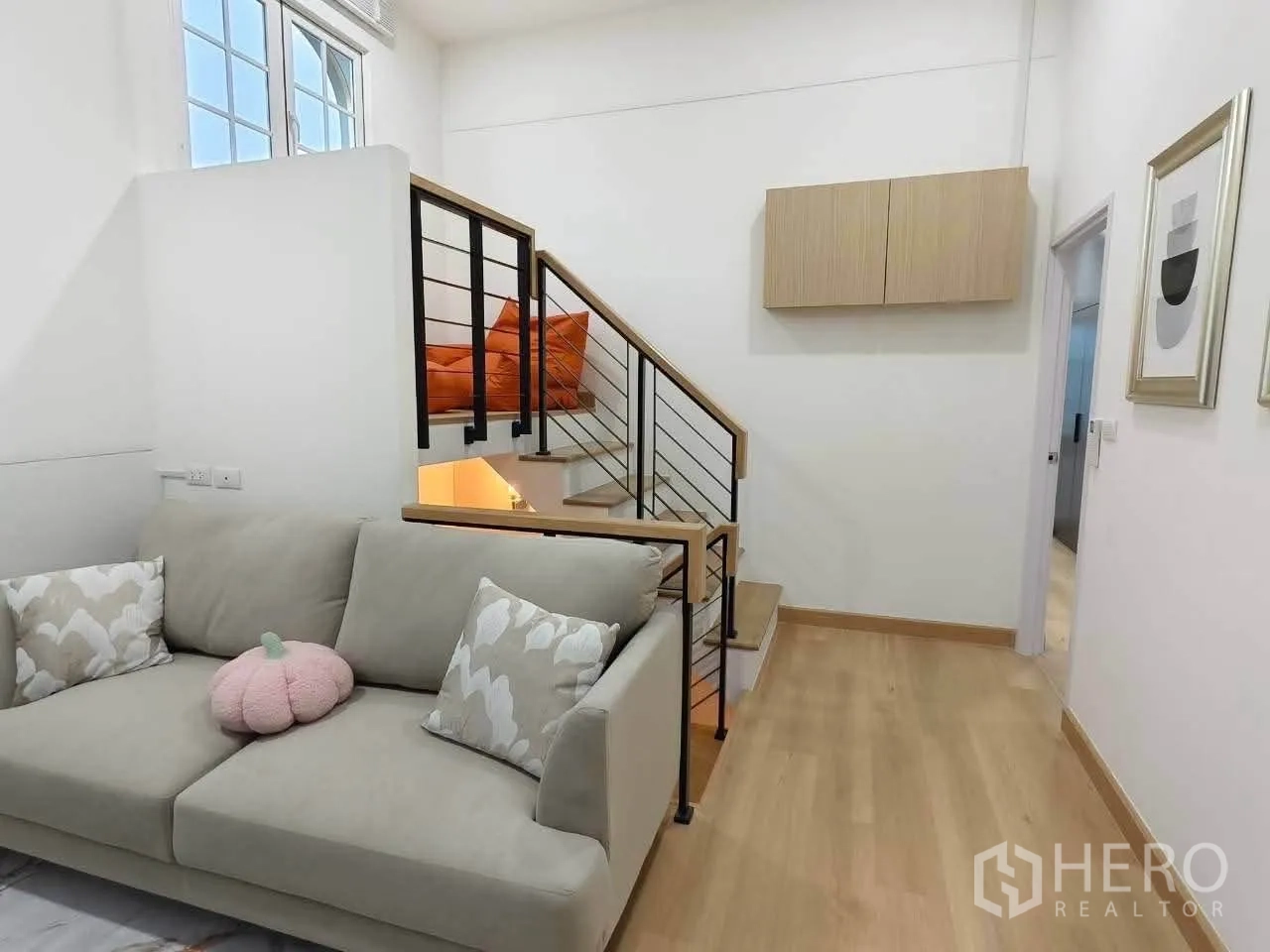 Detached House for rent in Bang Phli, Samut Prakan - Another view of the lounge showing sofa seating and the staircase.