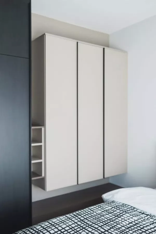 Detached House for rent in Bang Phli, Samut Prakan - Built-in bedroom wardrobe with minimalist panel doors and open shelving.