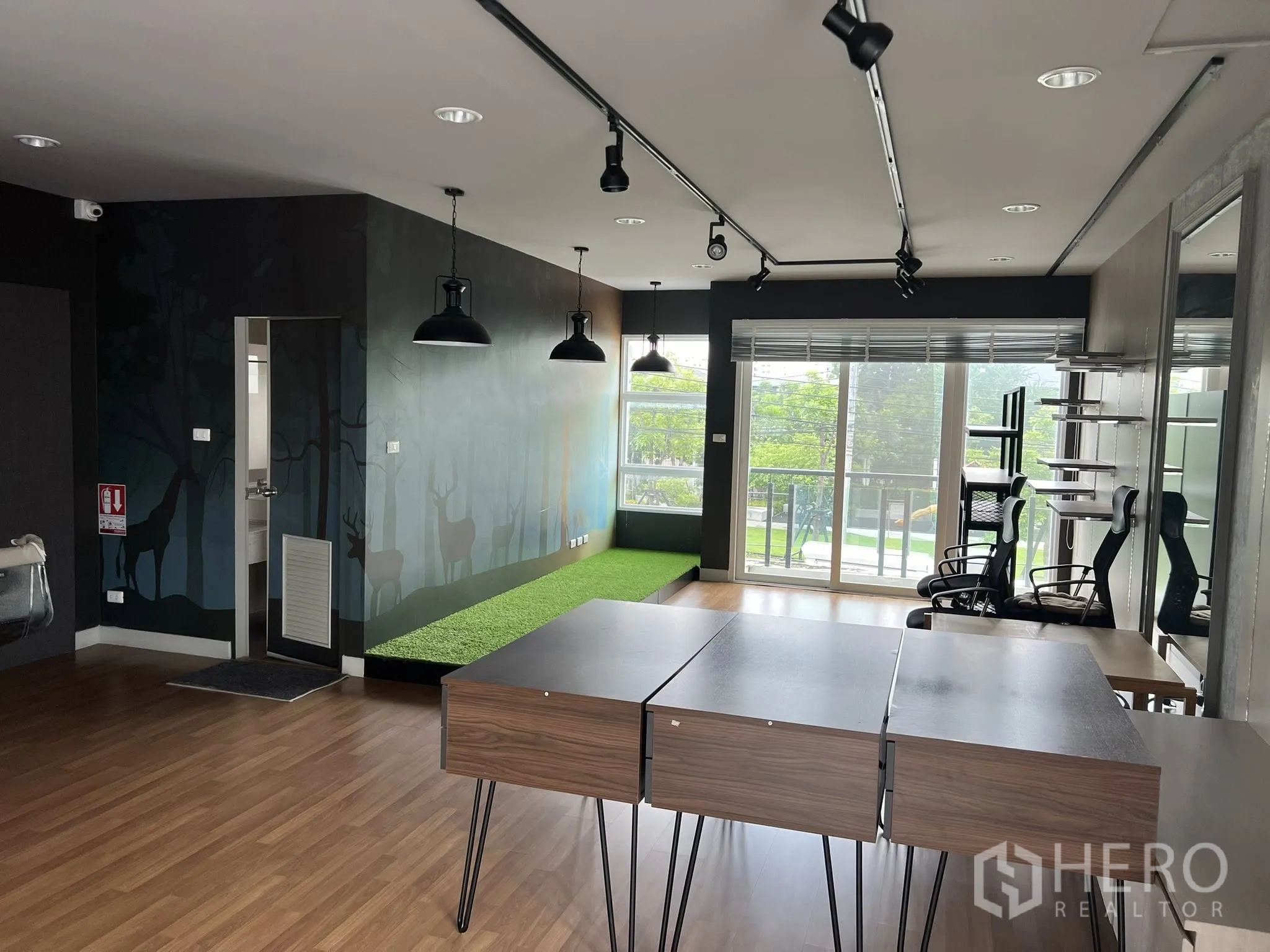 Detached House for rent or sale in Don Mueang, Bangkok - Open office area with balcony view and multiple work chairs.