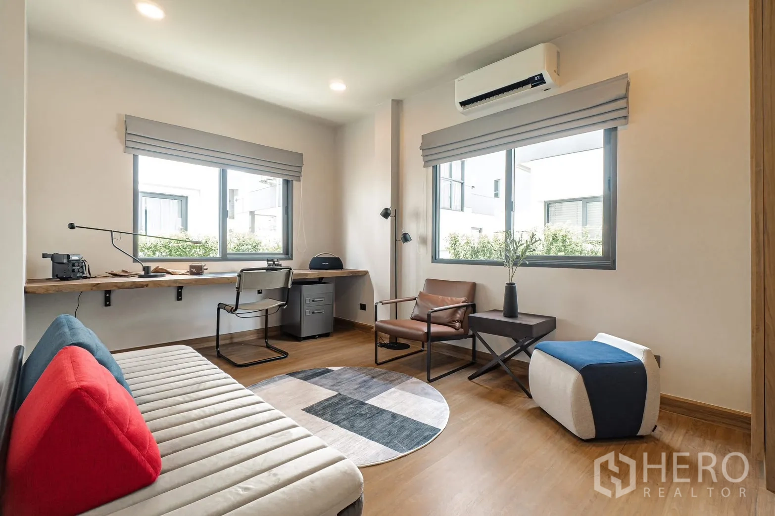 Detached House for rent in Bang Phli, Samut Prakan - Bright multi-purpose room with three windows, AC, and modern furniture.