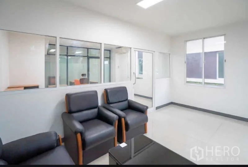 Home Office for rent or sale in Lat Krabang, Bangkok - Waiting area with armchairs and internal windows to office.