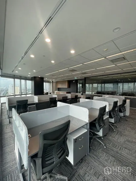 Office Space for rent in Dusit, Bangkok - Spacious open office area with glass-partitioned meeting room and multiple work pods.