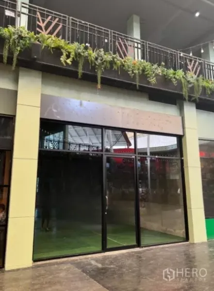 Retail Space for rent - Ground-floor retail shopfront with full-height glass doors and a covered arcade in Suan Luang, Bangkok.