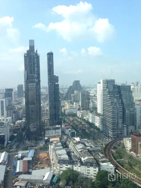 Condominium for rent or sale in Bang Rak, Bangkok - Bang Rak skyline view including modern towers and BTS tracks near Chong Nonsi.