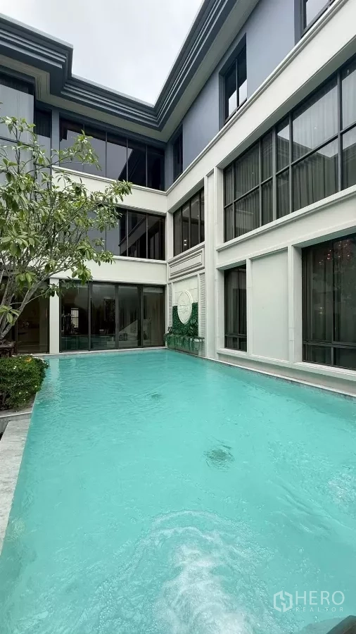 Detached House for sale in Saphan Sung, Bangkok - Private 6×12-metre swimming pool in an inner courtyard framed by large glass windows.