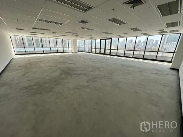 Office Space for rent in Watthana, Bangkok - Expansive open-plan office with wraparound glazing and a wide city panorama.