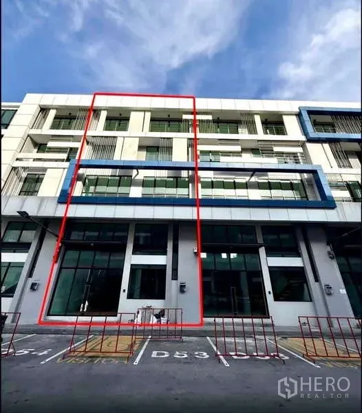 Home Office for rent in Bueng Kum, Bangkok - Modern four-storey home office facade with the unit outlined and parking bays in front.
