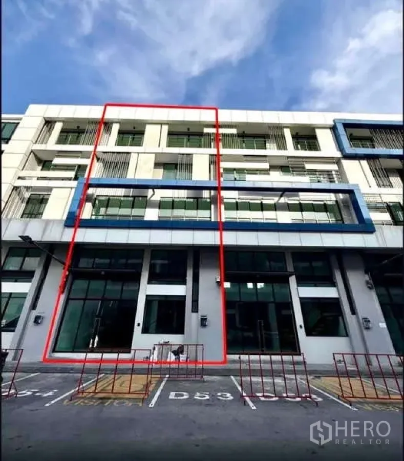 Home Office for rent in Bueng Kum, Bangkok - Modern four-storey home office facade with the unit outlined and parking bays in front.