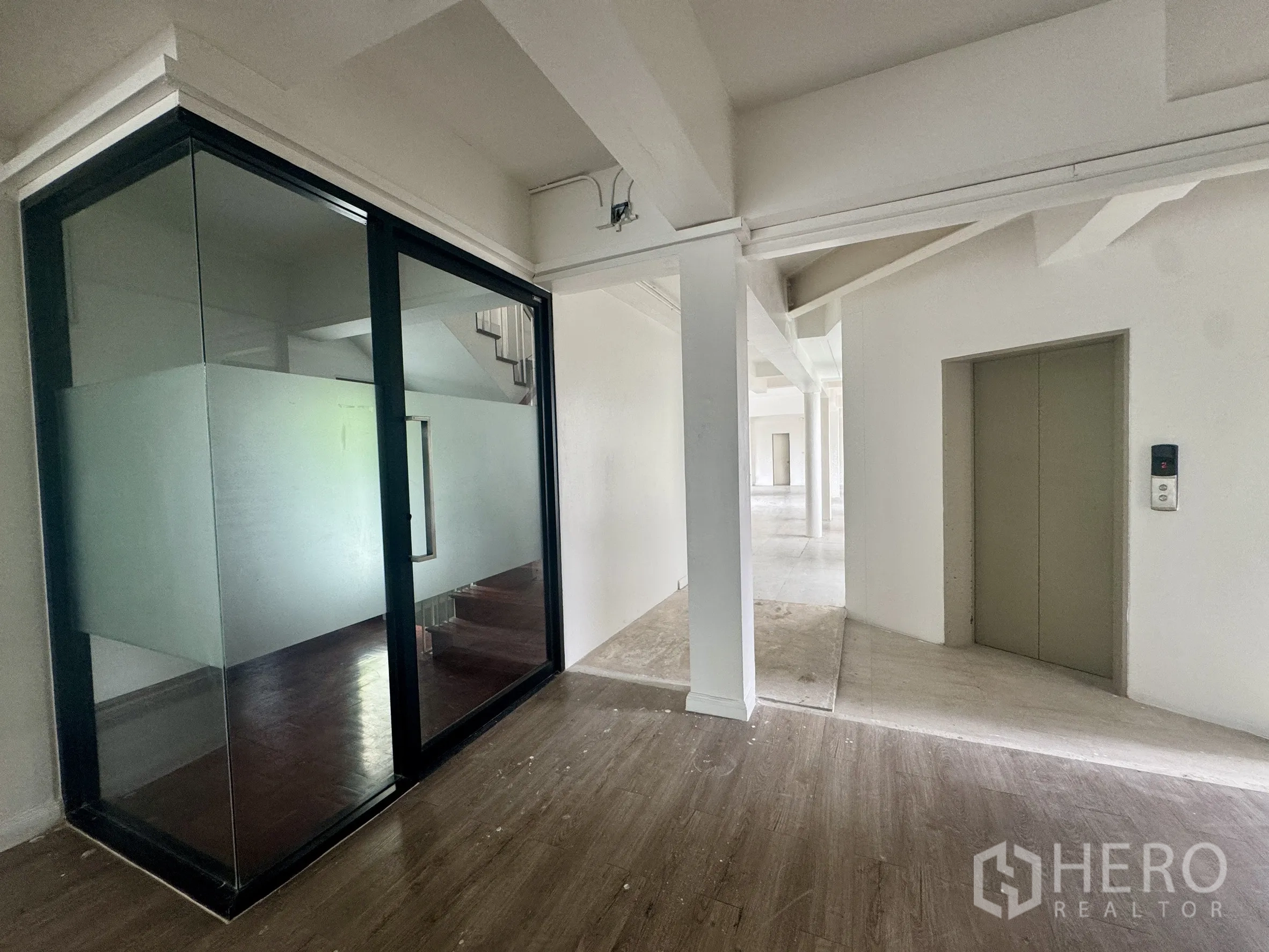 Office Space for rent in Sathon, Bangkok - Private elevator lobby with sliding glass room and internal staircase inside the office.