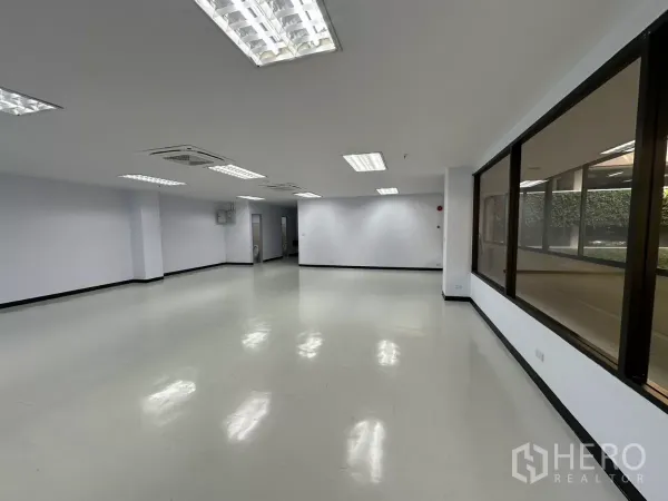 Office Space for rent - Corner view of office highlighting generous layout, window frontage and clean white walls.